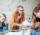 group-of-upset-students-sitting-at-the-table-with-E5YW9L4.jpg