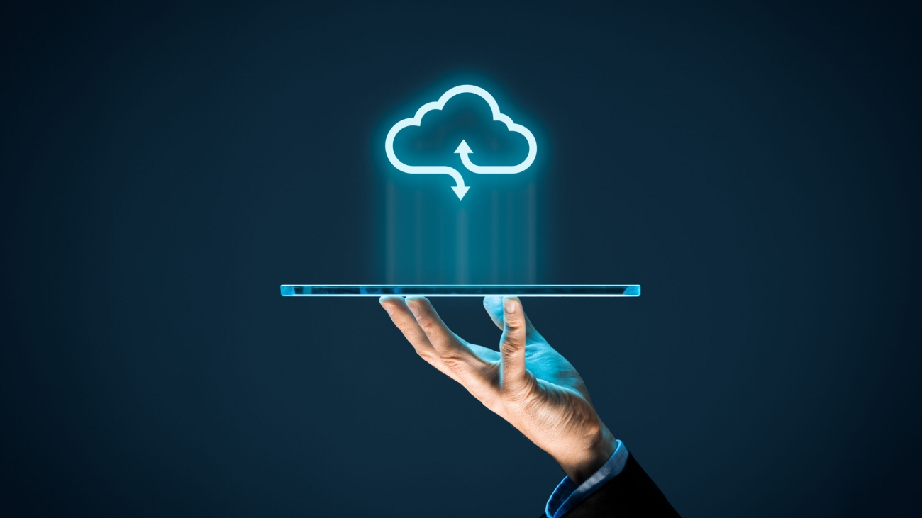 Cloud computing concept - connect devices to cloud. Businessman or information technologist with cloud computing icon and tablet.